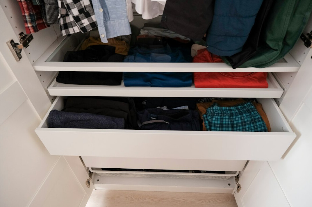 person organizing drawers